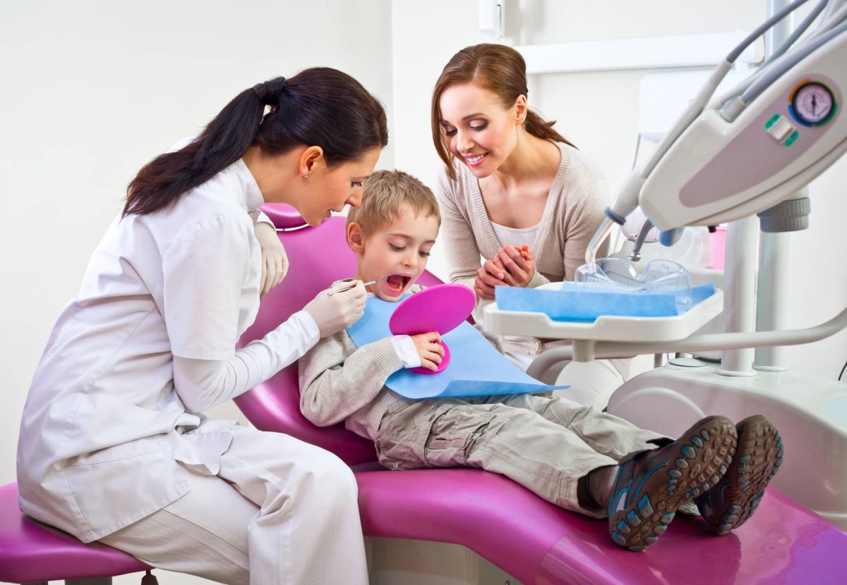 Boy in dentist examination chair